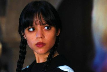 Wednesday Addams (Jenna Ortega) looking somewhat shocked in Wednesday.