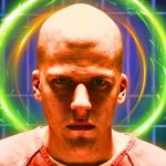 Jese Eisenberg looking serious as Lex Luthor with a halo in his background
